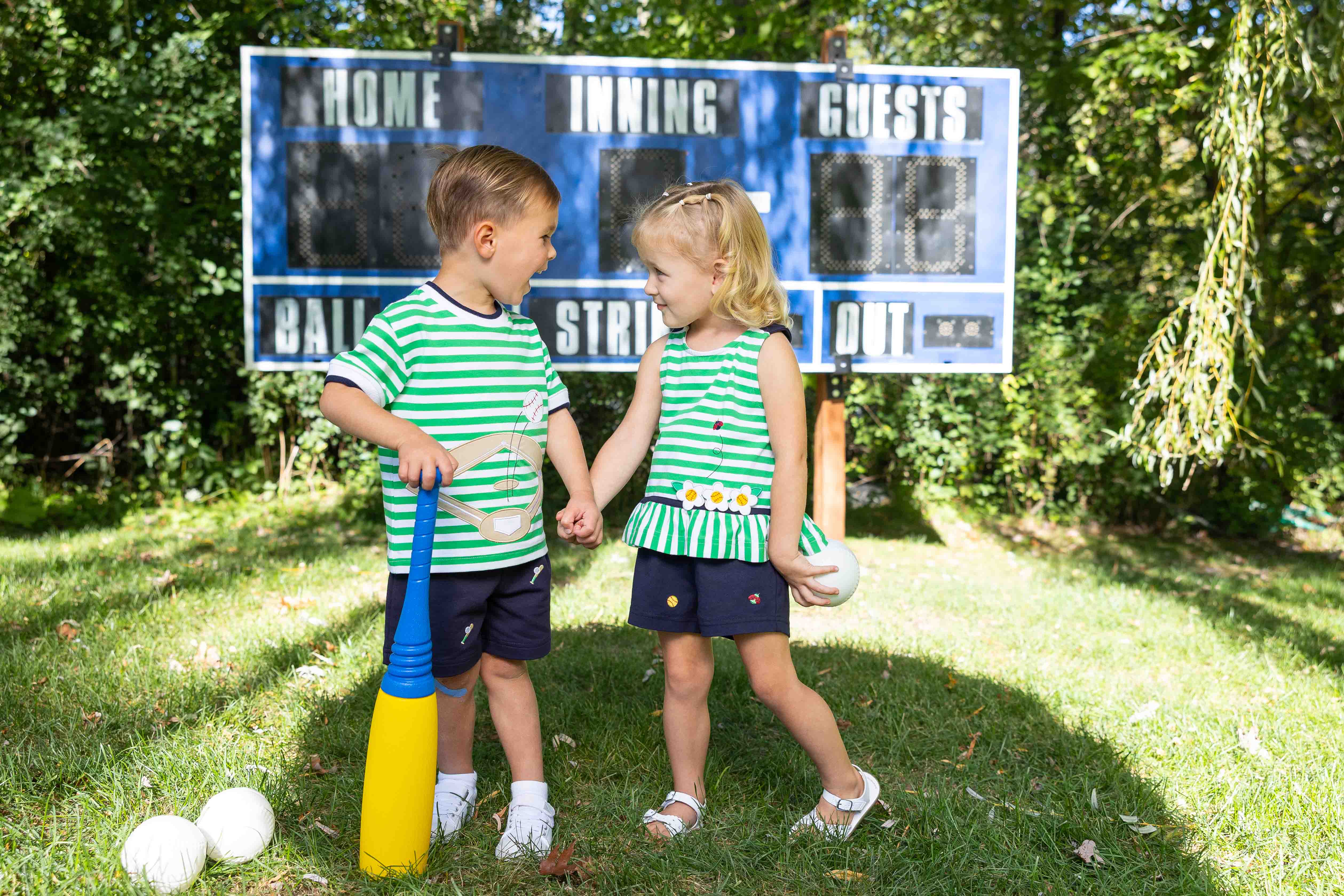 two children in golf themed outfits