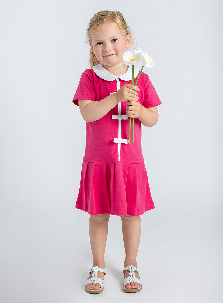 young girl in fuschia dress with bows