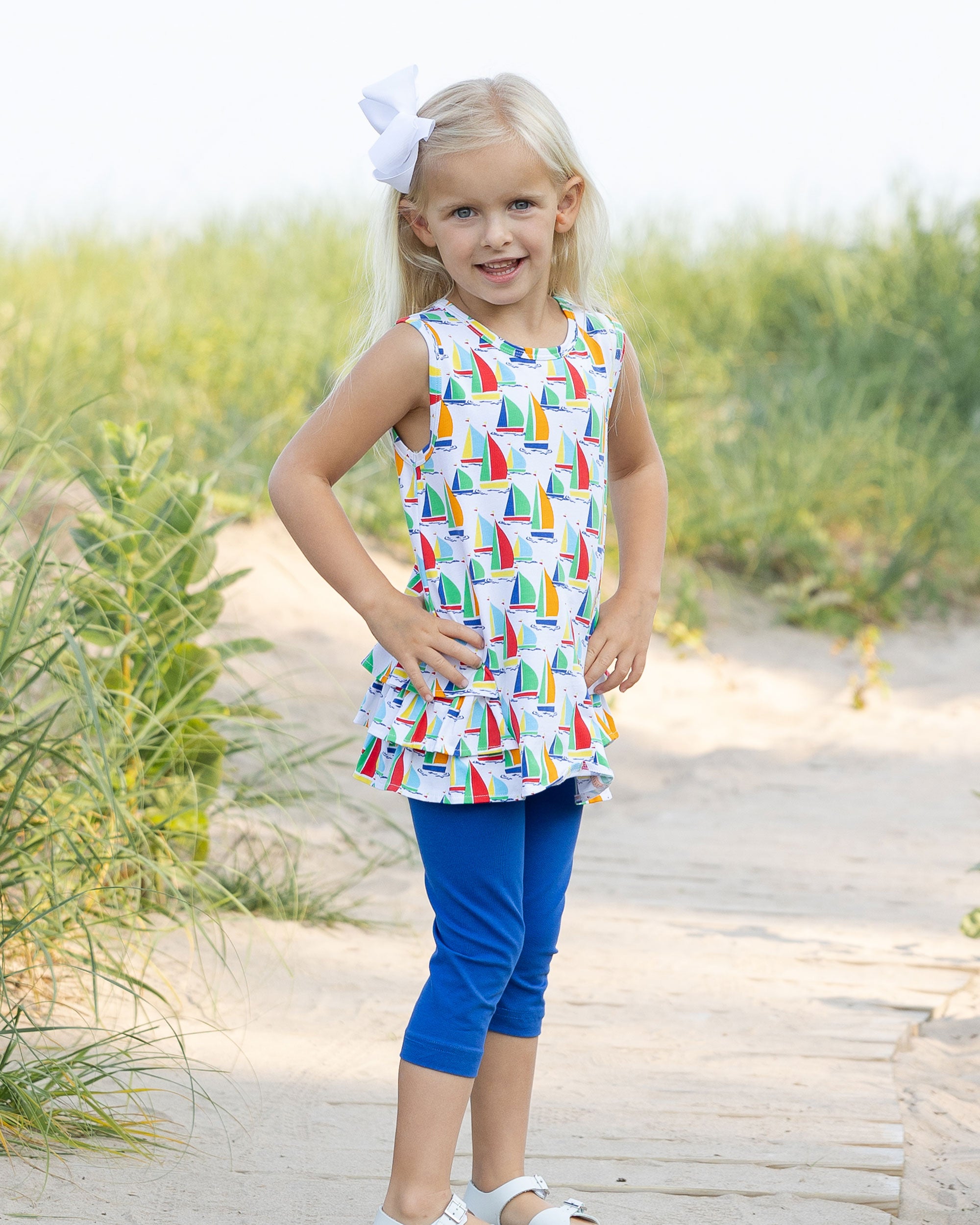 young girl on boardwalk wearing Sailboat Print Tunic with Capri Leggings