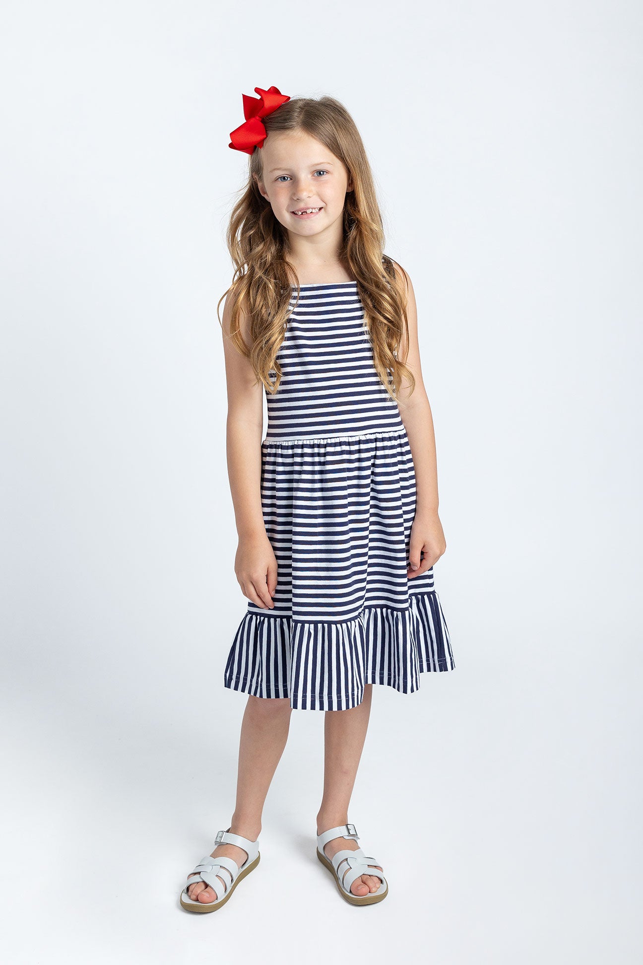 girl in navy stripe dress