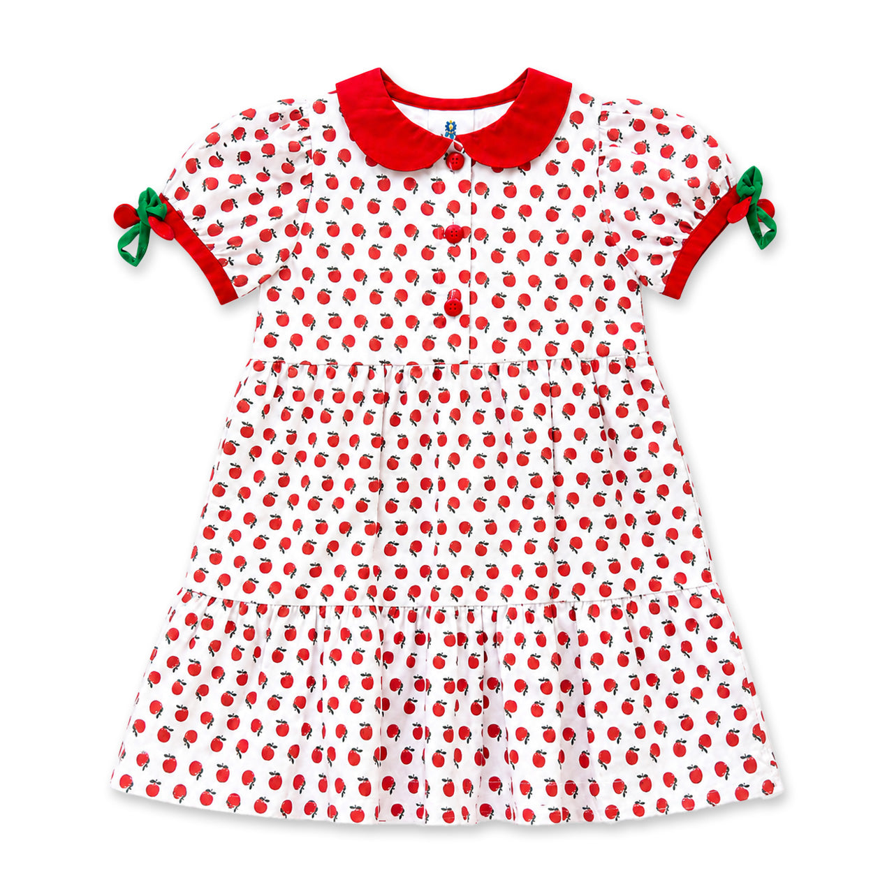 Red and white apple print dress with red collar and green bows on a white background