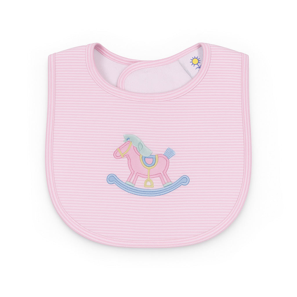 Pink baby bib with a rocking horse design on a white background