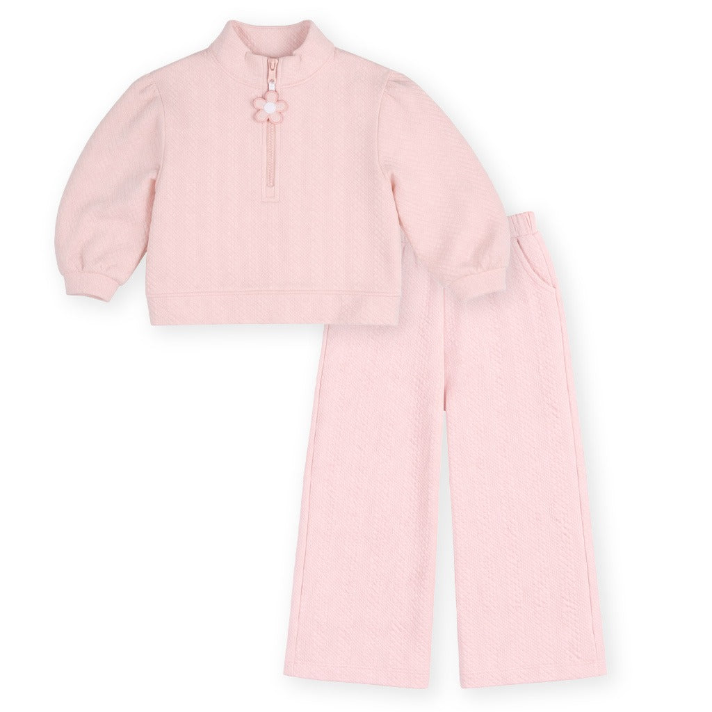 Pink long-sleeve top with a zipper and wide leg pants on a white background