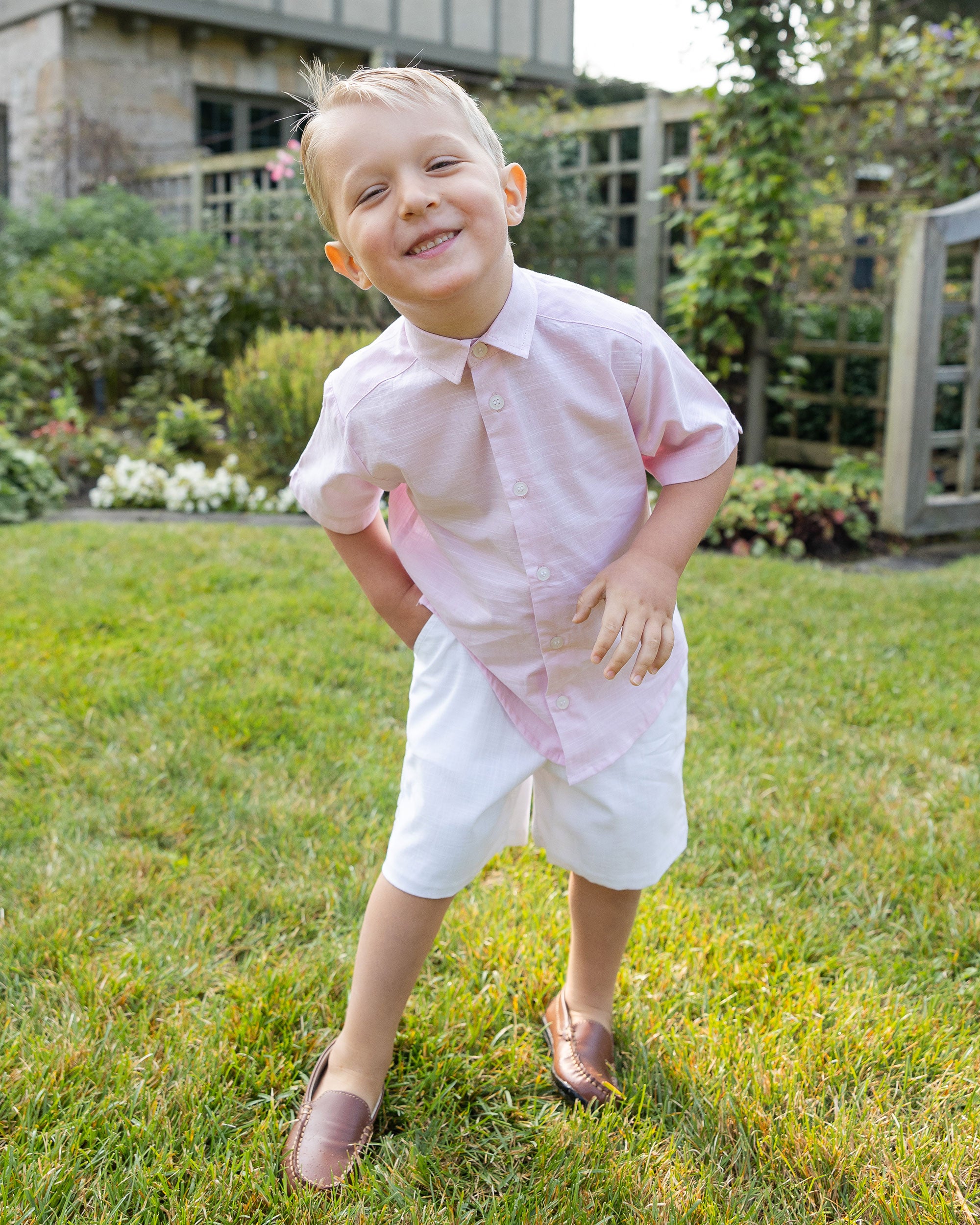 young boy in pink linen look camp shirt