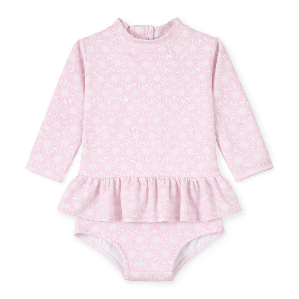 Pink baby swimsuit with long-sleeve top and ruffled bottom on a white background