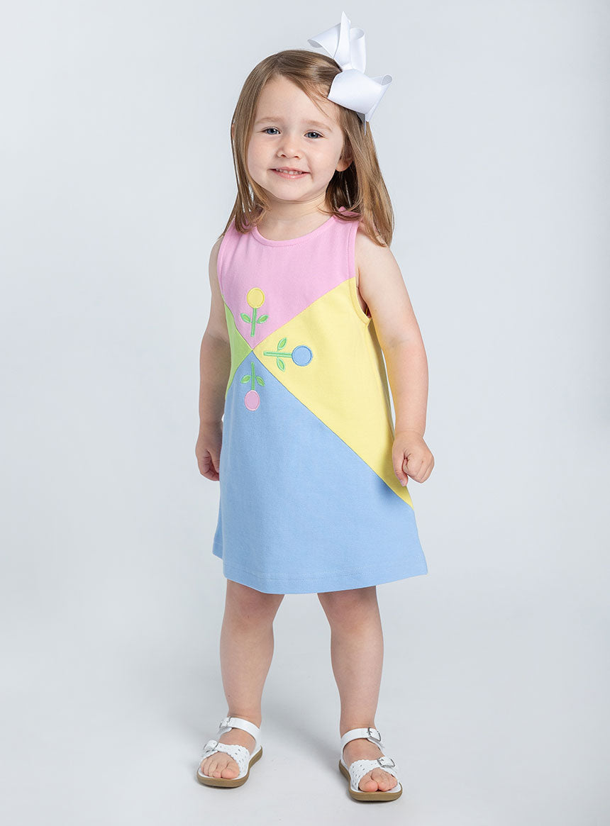 young girl in studio wearing jumper dress