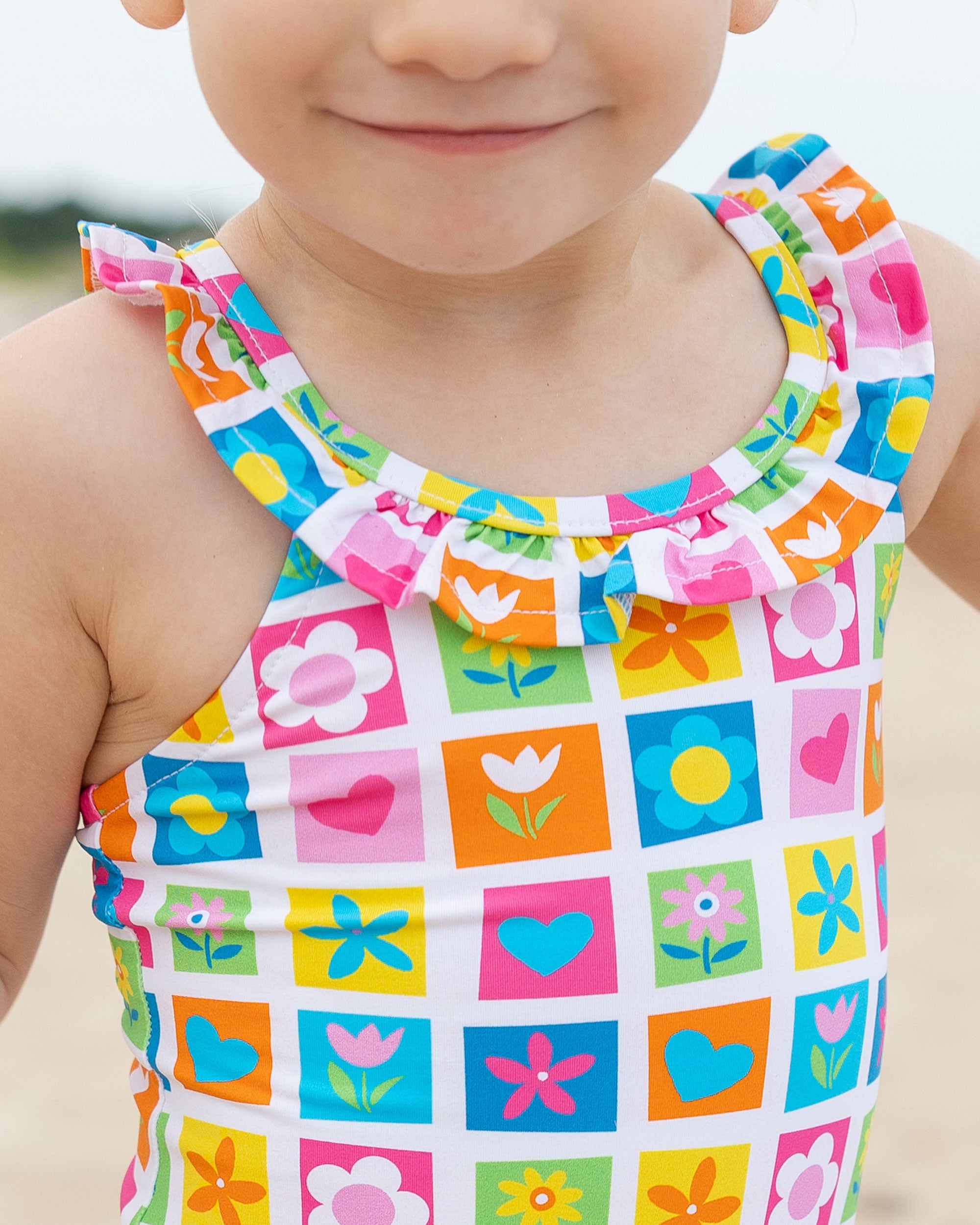 close up of patchwork floral swimsuit