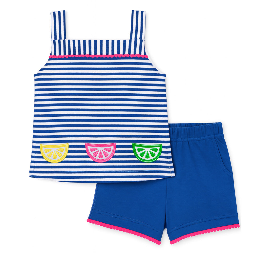 Striped dress with fruit appliqués and blue shorts on a white background