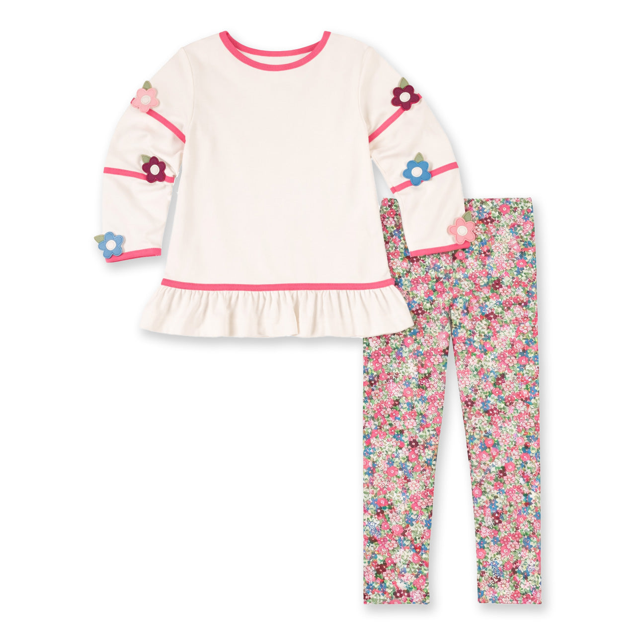 Children's outfit with ivory top and floral pants on a white background