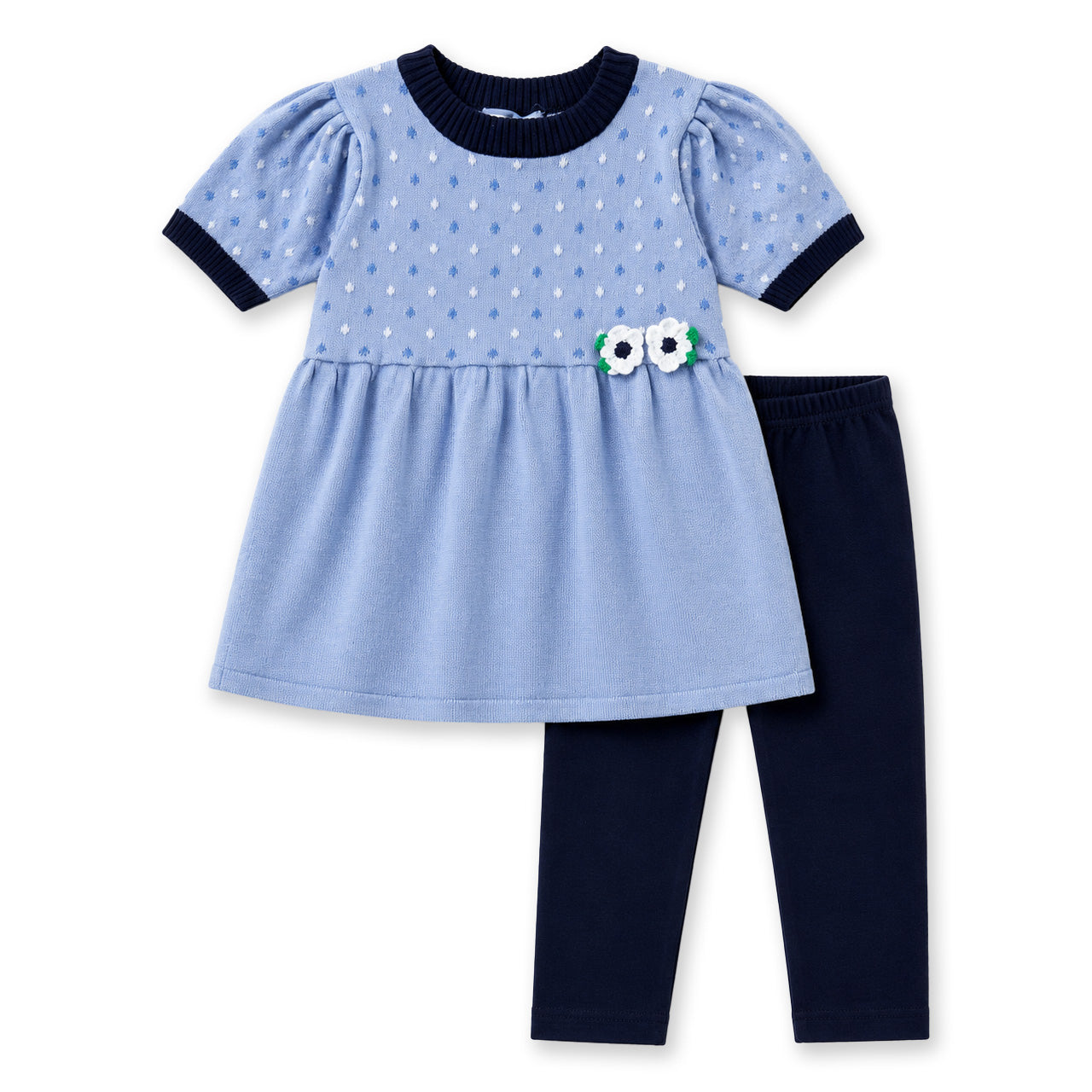 Sweater with blue and white polkadots and navy legging set on a white background