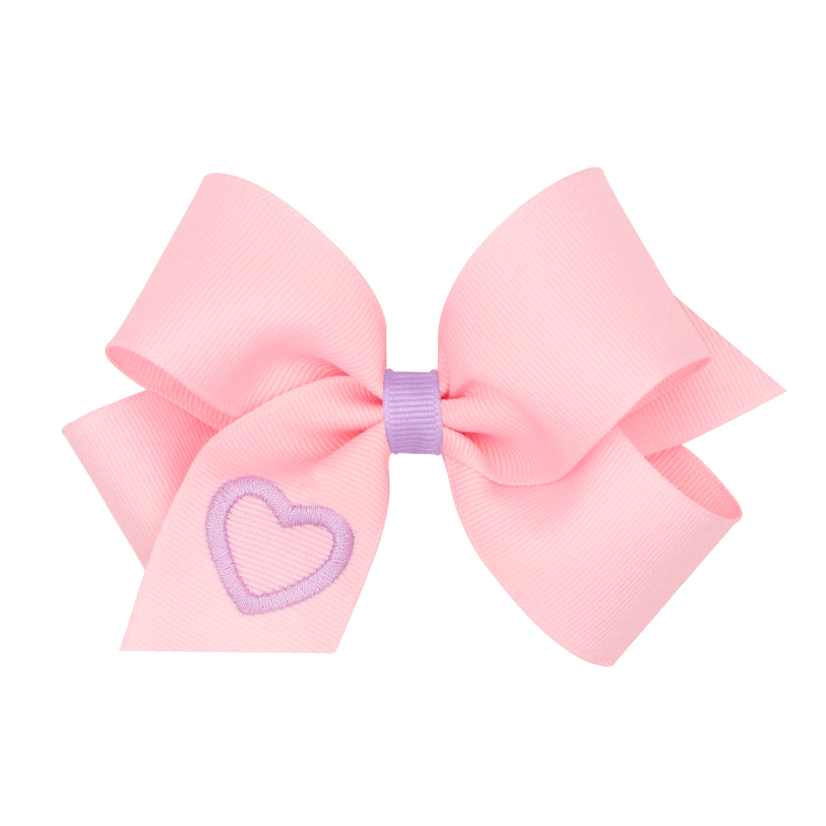 A light pink grosgrain ribbon hair bow with a small lavender embroidered heart on one loop and a matching lavender center band, shown on a plain white background.