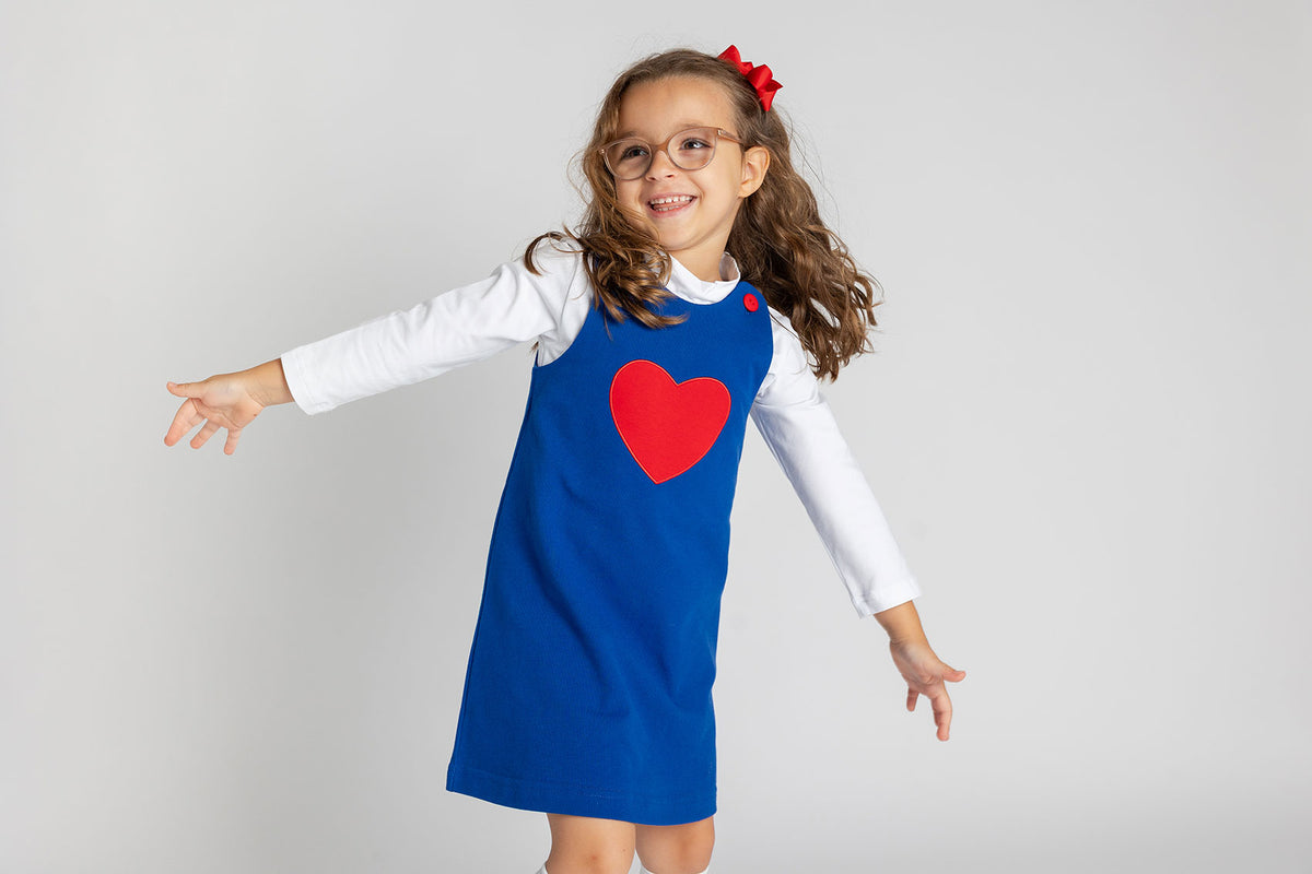 young girl in Lois Ehlert x Florence Eiseman Heart 2 Heart dress