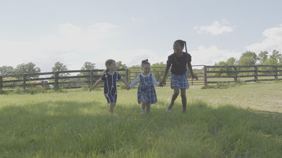 a compilation of childen in blue plaid on a farm